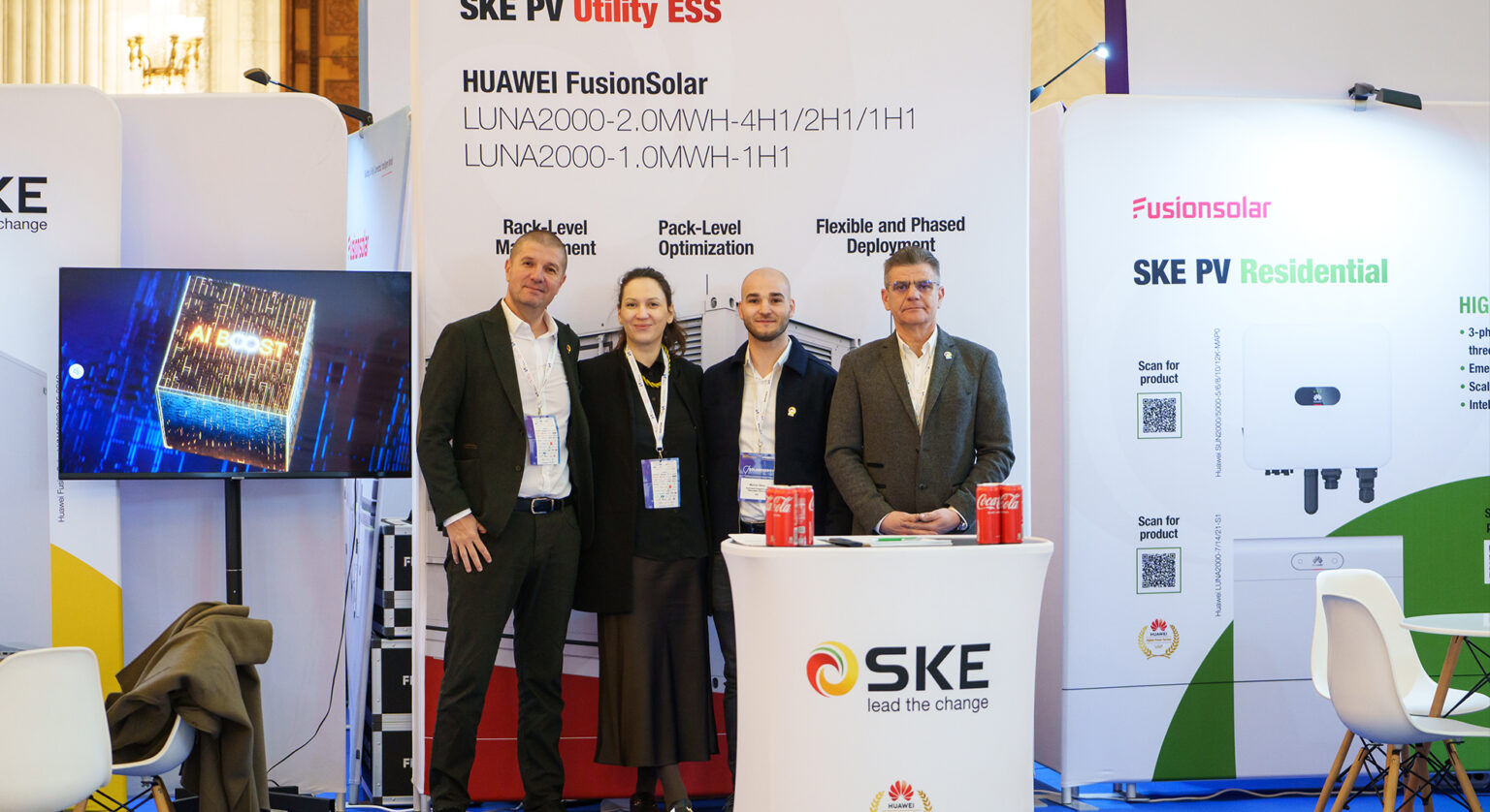SKE Solar Inverters: Integrated Solutions Become the Standard in New Energy Projects Four professionals posing at a trade show booth for SKE and Huawei FusionSolar, with banners in the background.